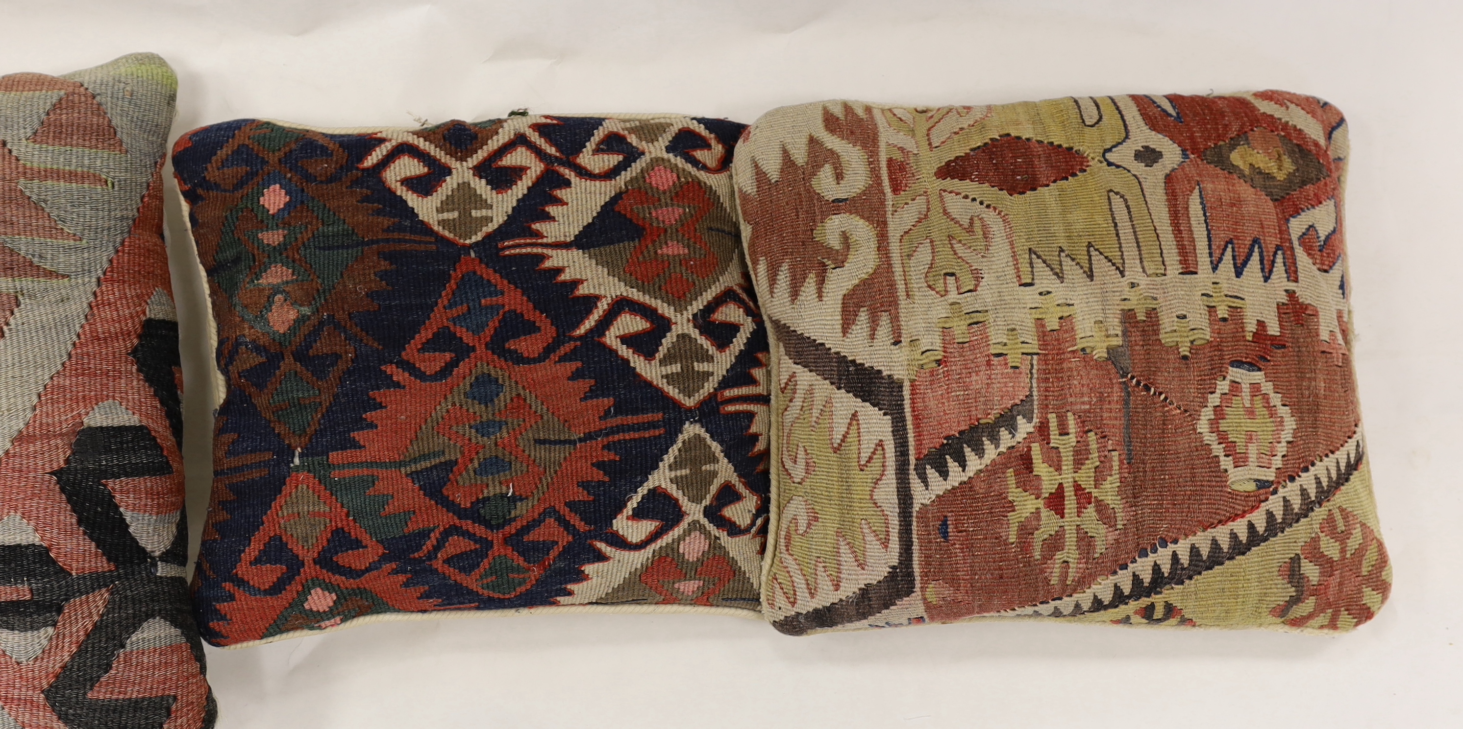 Four Kelim cushions, largest 43cm square